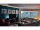 Spacious living room with sleek furniture, a vibrant accent wall, and plenty of natural light at 3430 77Th W St # 103, Bradenton, FL 34209