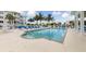 Resort-style pool surrounded by blue lounge chairs and beautiful landscaping at the pool at 3430 77Th W St # 103, Bradenton, FL 34209