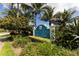 Entrance sign to Palma Sola Bay Club surrounded by lush tropical landscaping at 3430 77Th W St # 103, Bradenton, FL 34209