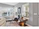 Cozy sitting area with a comfortable chair, soft rug, and plenty of natural light at 3430 77Th W St # 103, Bradenton, FL 34209