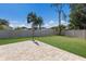 Backyard featuring a stone paver patio, lush lawn, and privacy fence at 4119 101St E Ave, Parrish, FL 34219