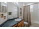 Bathroom featuring a sink, shower-tub, and palm tree accents at 4119 101St E Ave, Parrish, FL 34219
