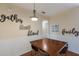 Dining area with wood table, chairs, and decorative wall art at 4119 101St E Ave, Parrish, FL 34219