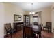 Elegant dining room with dark wood furniture, hardwood floors, and a chandelier at 4119 101St E Ave, Parrish, FL 34219