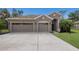 Charming home with a two-car garage, well-manicured lawn and inviting entry at 4119 101St E Ave, Parrish, FL 34219