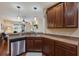 Kitchen counter with stainless steel sink, appliances and dark wood cabinets at 4119 101St E Ave, Parrish, FL 34219