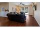 Gathering room featuring hardwood floors, a television, and a view of the pool area at 4119 101St E Ave, Parrish, FL 34219