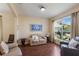 Inviting living area featuring hardwood floors, a large window, and neutral paint at 4119 101St E Ave, Parrish, FL 34219