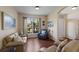 Comfortable living area featuring hardwood floors and a view through a window at 4119 101St E Ave, Parrish, FL 34219