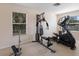 Bright workout room with multiple machines and natural light from the large window at 4119 101St E Ave, Parrish, FL 34219