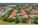 Wide aerial view of condo community boasting tranquil ponds and meticulously manicured landscaping at 4244 Central Sarasota Pkwy # 726, Sarasota, FL 34238
