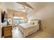 Cozy bedroom features a plush bed, dresser, and bright windows at 4244 Central Sarasota Pkwy # 726, Sarasota, FL 34238