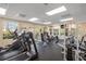 Bright community gym features modern equipment and large windows overlooking community at 4244 Central Sarasota Pkwy # 726, Sarasota, FL 34238