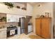 Bright kitchen features stainless steel appliances, granite countertops, and white cabinetry at 4244 Central Sarasota Pkwy # 726, Sarasota, FL 34238