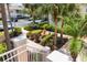 Manicured landscaping with water fountain and paver pathway leading to the community building at 4244 Central Sarasota Pkwy # 726, Sarasota, FL 34238
