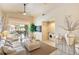 Spacious living room with vaulted ceilings and sliding glass doors to the lanai plus laundry closet at 4244 Central Sarasota Pkwy # 726, Sarasota, FL 34238