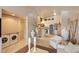 Open concept living room, kitchen and laundry area at 4244 Central Sarasota Pkwy # 726, Sarasota, FL 34238