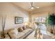 Inviting living room with large windows and comfortable seating at 4244 Central Sarasota Pkwy # 726, Sarasota, FL 34238