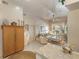 Open-concept living space showing living room furniture, decorative vases, a ceiling fan, and access to natural light at 4244 Central Sarasota Pkwy # 726, Sarasota, FL 34238