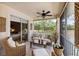 Inviting screened porch featuring comfortable seating and serene views, perfect for relaxing outdoors at 4244 Central Sarasota Pkwy # 726, Sarasota, FL 34238