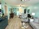 Bright living room with vinyl floors, dining table, and comfortable seating at 435 30Th W Ave # D304, Bradenton, FL 34205