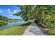 Waterside crushed gravel path features mature trees and water views at 4514 Trails Dr, Sarasota, FL 34232