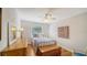 Light bedroom with hardwood floors, dresser, and natural light from window at 4514 Trails Dr, Sarasota, FL 34232
