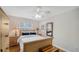 Bright bedroom featuring hardwood floors, ceiling fan, and natural light at 4514 Trails Dr, Sarasota, FL 34232
