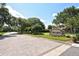 The Lakes neighborhood sign with landscaping and mature trees at 4514 Trails Dr, Sarasota, FL 34232