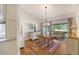 Cozy dining area with wood floors and sliding glass doors to a screened-in porch at 4514 Trails Dr, Sarasota, FL 34232