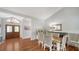 Elegant dining area featuring hardwood floors, stylish furnishings, and a decorative mirror at 4514 Trails Dr, Sarasota, FL 34232