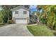 Charming two-story home featuring a well-maintained front yard and attached two car garage at 4514 Trails Dr, Sarasota, FL 34232