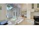 Bright kitchen features a farmhouse sink, granite counters, stainless appliances, and a large window at 4514 Trails Dr, Sarasota, FL 34232