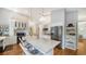 Bright kitchen featuring white cabinets, stainless steel appliances, and a large center island with seating at 4514 Trails Dr, Sarasota, FL 34232