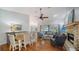 Bright living room and dining area with a cozy fireplace and hardwood flooring at 4514 Trails Dr, Sarasota, FL 34232