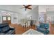 Open-concept layout featuring hardwood floors, dining area, and comfortable seating at 4514 Trails Dr, Sarasota, FL 34232