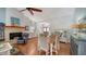 Bright living area with hardwood floors, dining space, and brick fireplace at 4514 Trails Dr, Sarasota, FL 34232