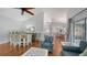Inviting living area featuring a fireplace, dining area, and hardwood flooring at 4514 Trails Dr, Sarasota, FL 34232