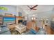 Bright living room boasts a brick fireplace and views of the entry and dining area at 4514 Trails Dr, Sarasota, FL 34232