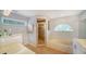 This bathroom features a walk-in shower, soaking tub, double sinks and updated fixtures at 4514 Trails Dr, Sarasota, FL 34232