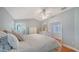 Spacious main bedroom with hardwood floors, neutral colors, walk-in closet, and ensuite bathroom at 4514 Trails Dr, Sarasota, FL 34232