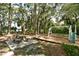 Community playground area featuring a picnic table, swing set and slide for outdoor enjoyment at 4514 Trails Dr, Sarasota, FL 34232