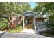 Charming recreation center entrance with a welcoming walkway and beautiful landscaping at 4514 Trails Dr, Sarasota, FL 34232