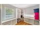 Well-organized walk-in closet with custom shelving and storage, bright natural light, and hardwood floors at 4514 Trails Dr, Sarasota, FL 34232