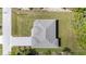 Overhead aerial view of a modern home's roof, driveway and lawn at 4661 Forlano Cir, North Port, FL 34291