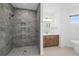 Modern bathroom featuring a glass enclosed shower with gray tiling and double sink vanity at 4661 Forlano Cir, North Port, FL 34291