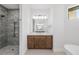 Contemporary bathroom featuring a glass-enclosed shower, vanity, and soaking tub at 4661 Forlano Cir, North Port, FL 34291