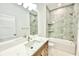 Bathroom featuring a shower-tub combo with modern fixtures and a marble countertop at 4661 Forlano Cir, North Port, FL 34291