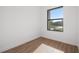 Bright bedroom with wood floors and a window offering natural light and suburban views at 4661 Forlano Cir, North Port, FL 34291