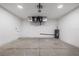 Spacious garage with epoxy floor, water heater, garage door opener and storage space at 4661 Forlano Cir, North Port, FL 34291